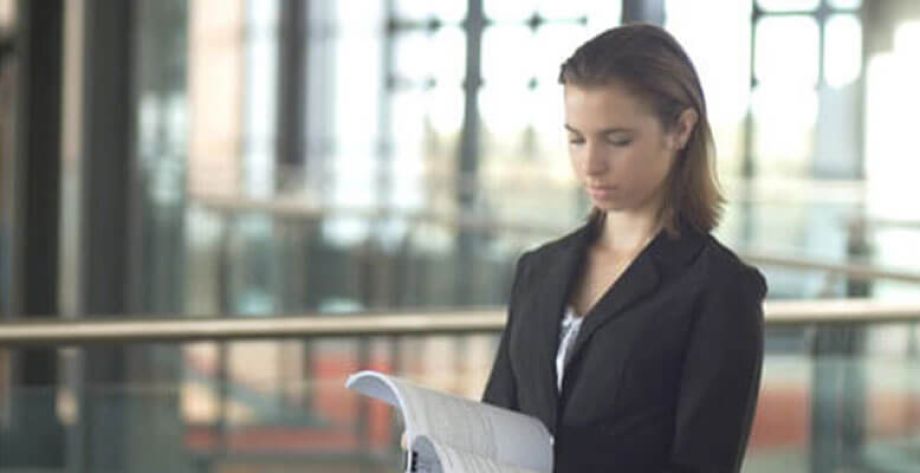 woman looking at research report